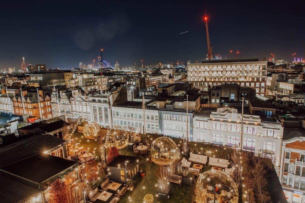 a view of London's skyline, focusing on the rooftop igloos making up a portion of the willows on the roof pop up